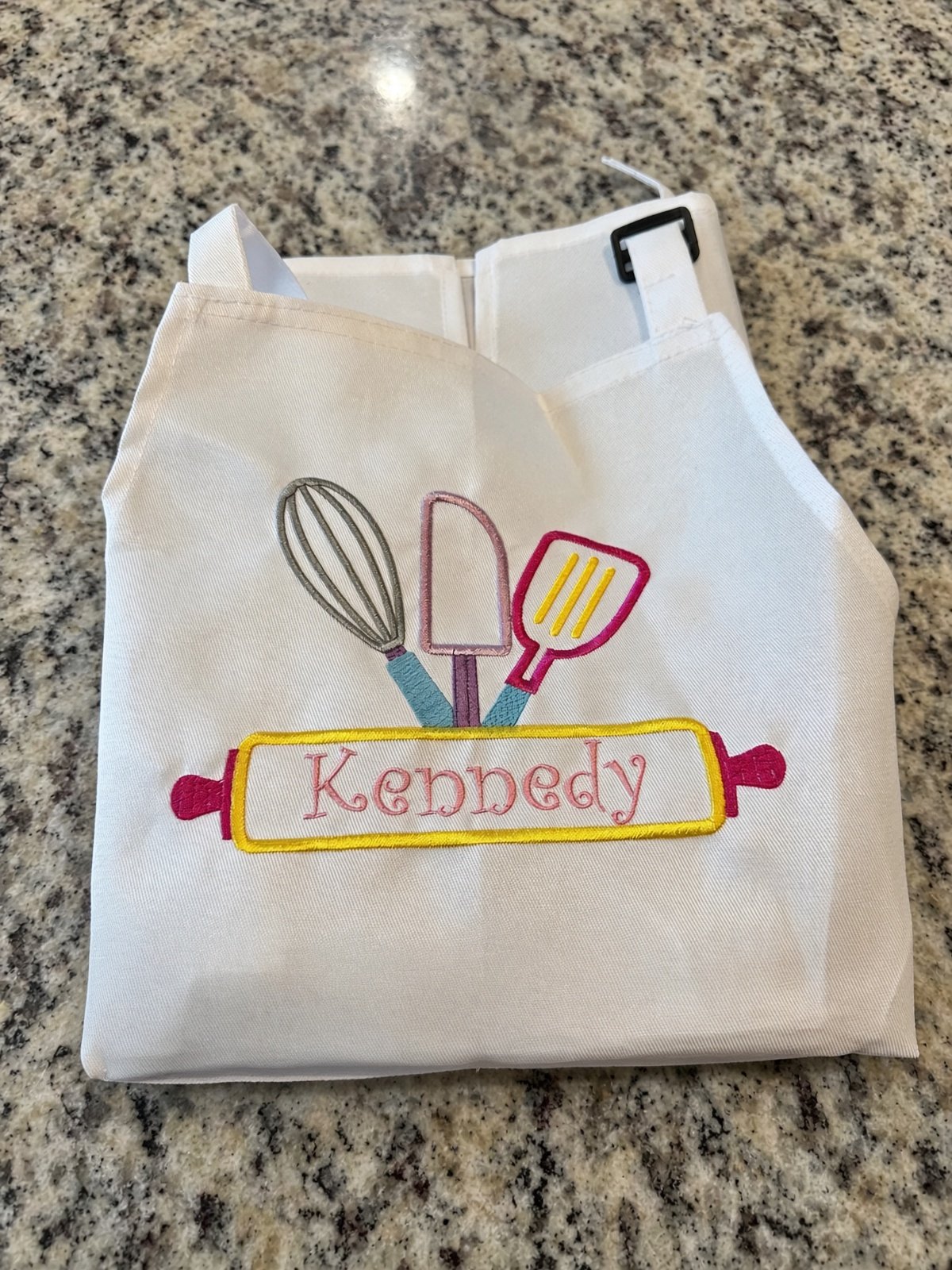 Kid's embroidery apron with colorful stitching