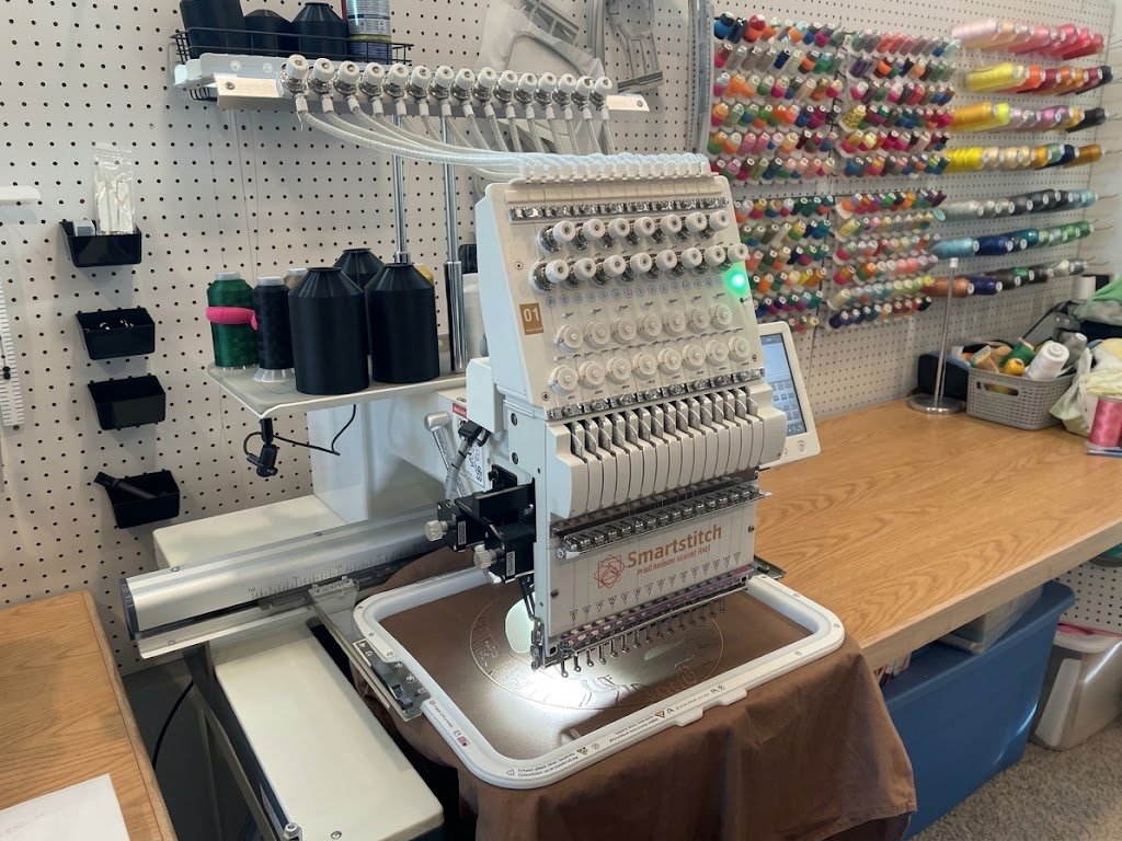Close view of the embroidery machine and thread setup
